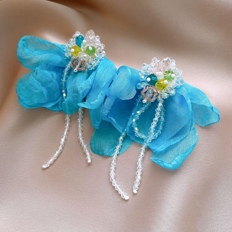 03357b876f77c5c29bbaf095fb102b59.jpg Fashionslee Women Dick Blue Flower Earrings