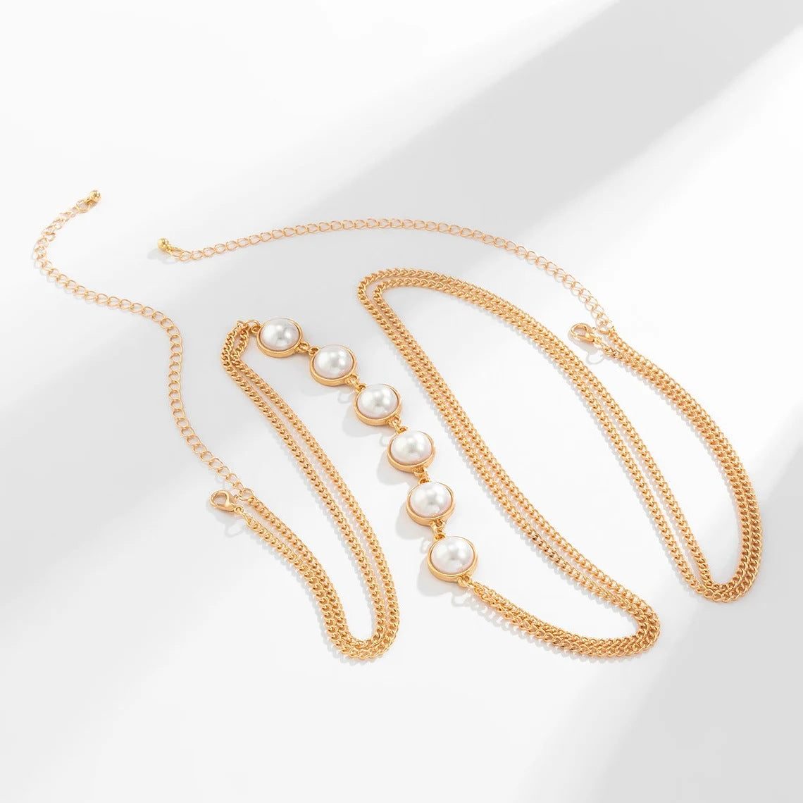 TRENDING GOLD BODY CHAIN PEARL CROSSOVER CHEST - OWNCI TRENDING GOLD BODY CHAIN PEARL CROSSOVER CHEST - OWNCI