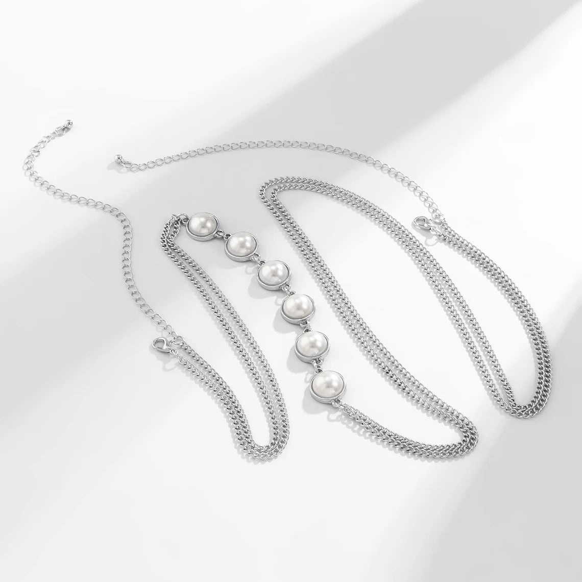 a7f26e1705bbcca3a579339e9f46b3ac.jpeg Fashionslee Women Pearl Crossover Chest Body Chain In Silver