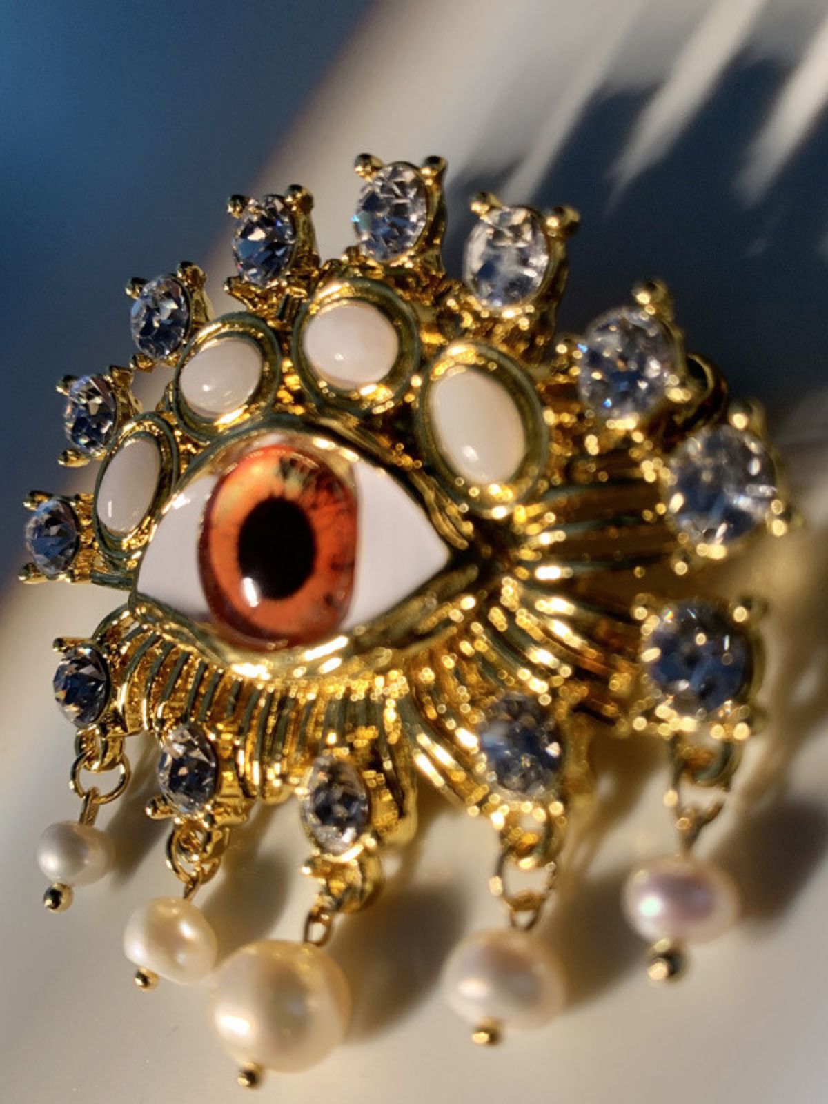 b1da762df6e918c7597c393e616b6a11.jpeg Fashionslee Women Pearl Embellihsed Eye Brooch