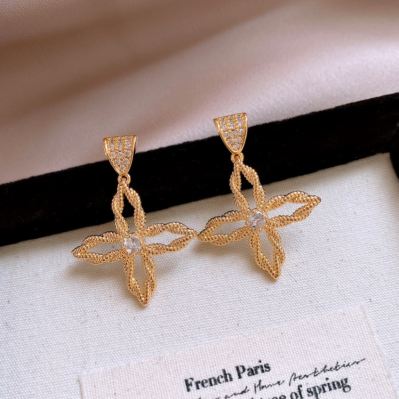b58f3ce3903cf229985caa9ae600752c.jpg Fashionslee Women Del Gold Cross Flower Earrings