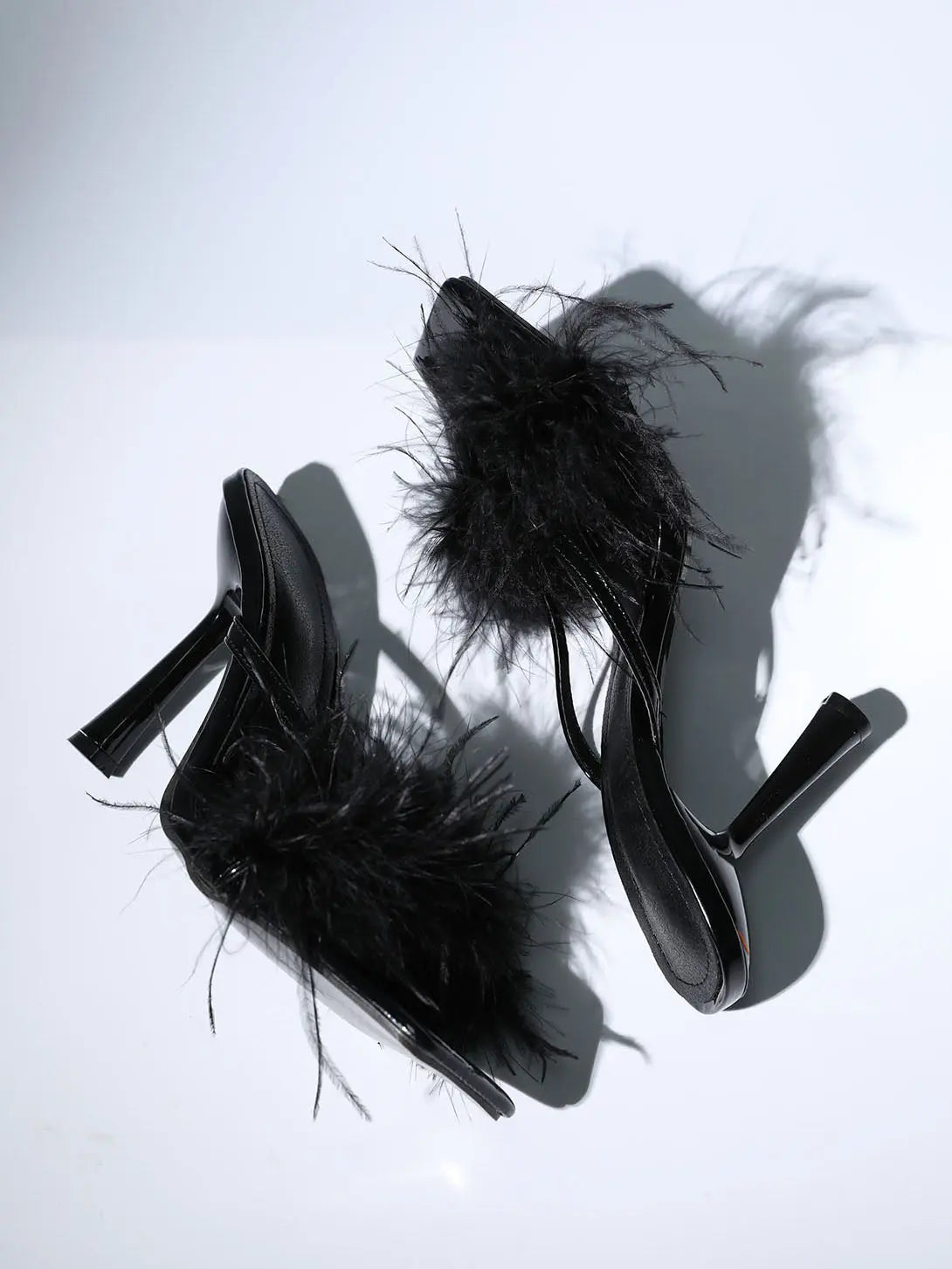 e525687c2e70dd3d50a7491b3d5465c6.jpeg Fashionslee Women Feather Heels In Black