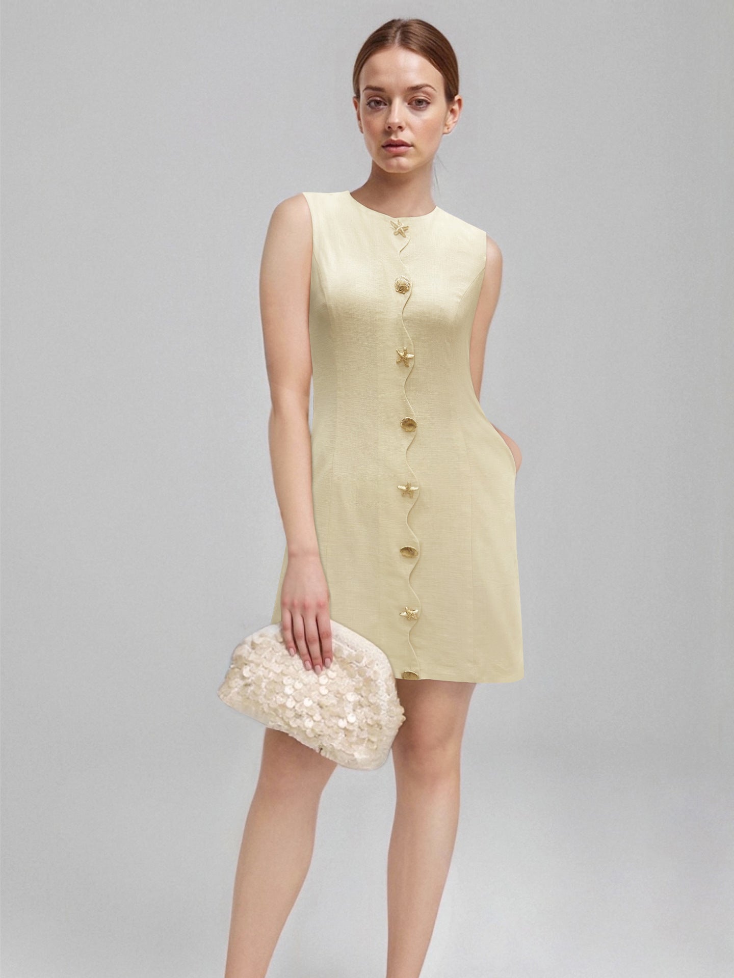 e1ca17eb1e165c74971021f43d81e6d9 Pale Yellow Sleeveless Round Neck Star Shell Button Straight Mini Dress