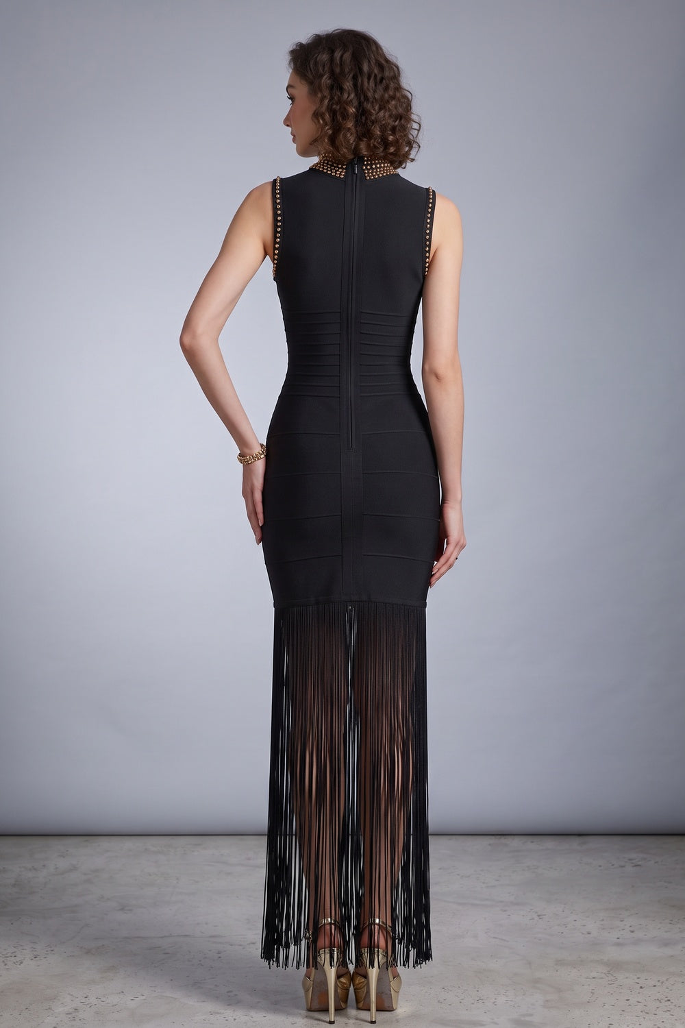 Black Heavy Bandage Knit Maxi Dress with Fringe Hem and Gold Embellishments - OWNCI Black Heavy Bandage Knit Maxi Dress with Fringe Hem and Gold Embellishments - OWNCI